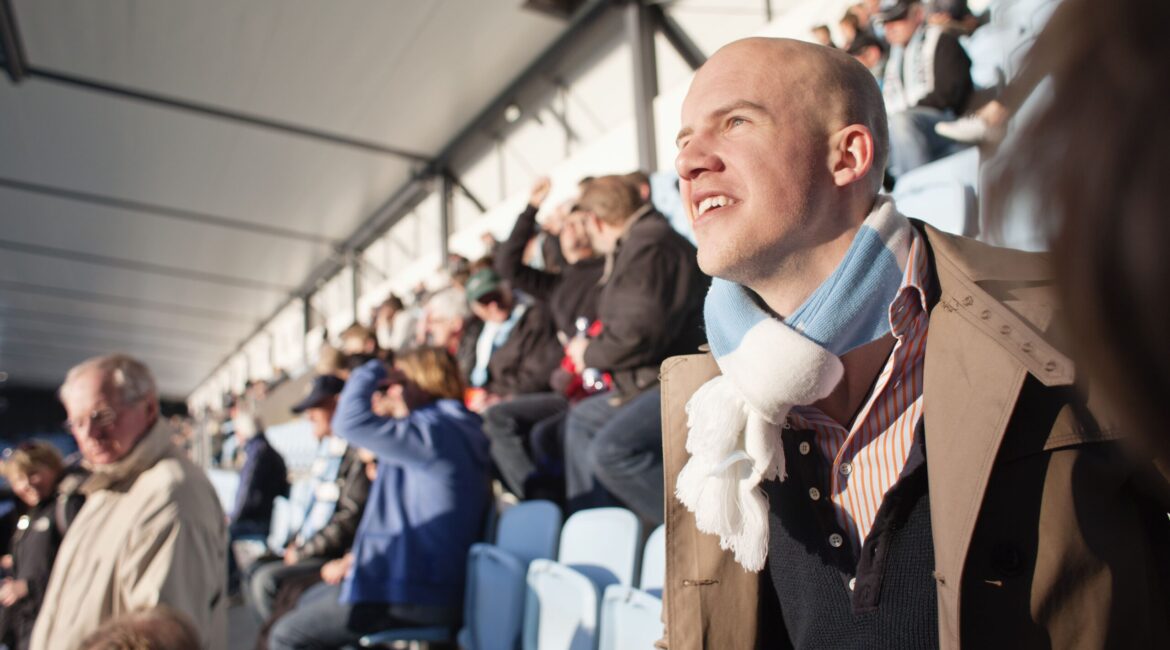 people-watching-match-at-stadium-on-sunny-day-2021-08-28-23-54-02-utc